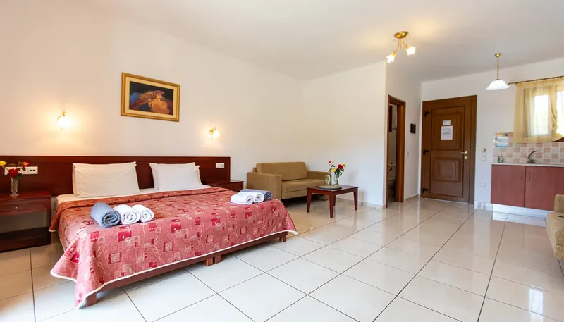 An apartment with its bed and sitting area