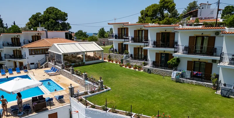 The apartment buildings, the pool and the lawn from the air