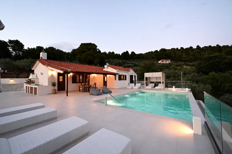 Emerald Diamond Villa at dusk, lit beside its pool