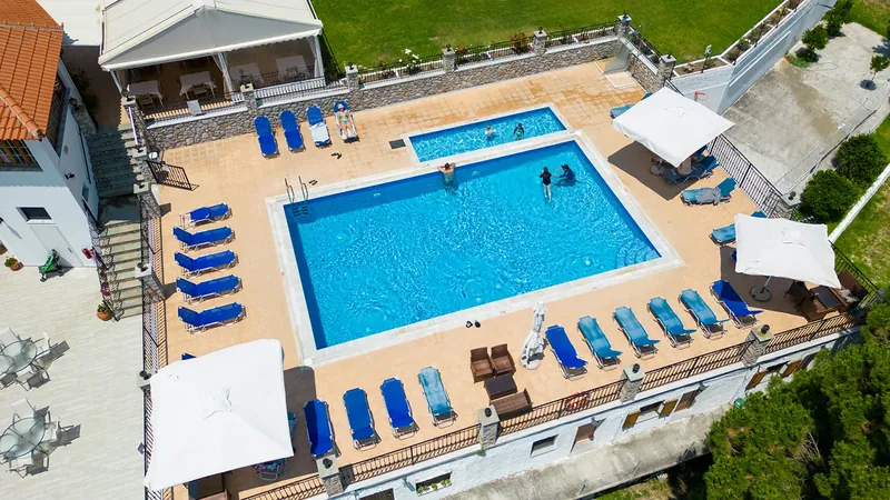 The pool and rows of sunbeds from above