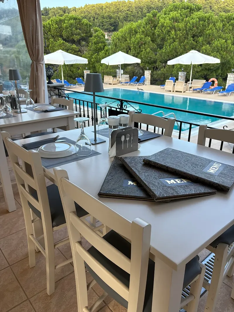 A table set beside the pool