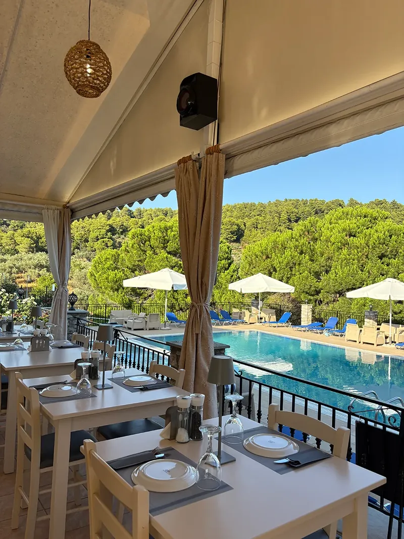A taverna table with the pool below