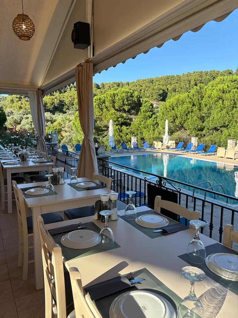 Taverna tables looking over the pool