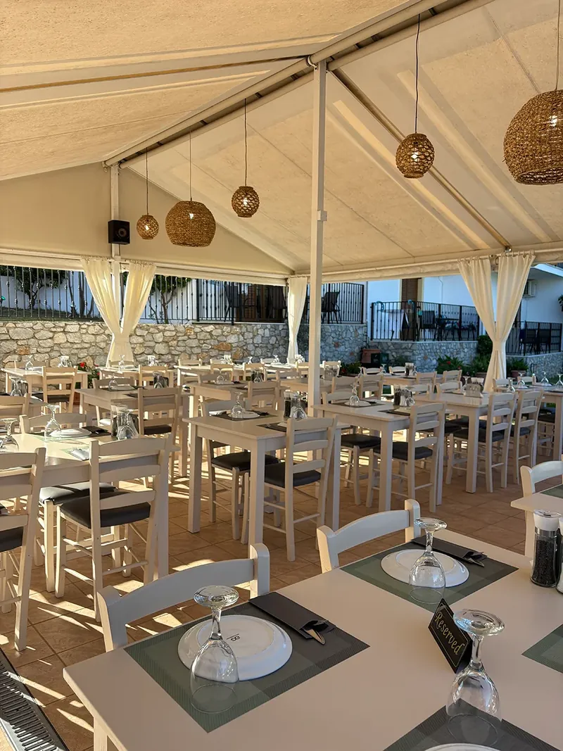 Tables under the taverna canopy