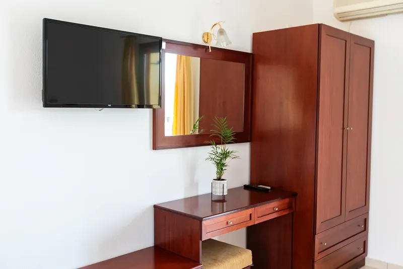 The TV, desk and wardrobe